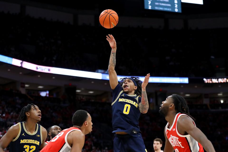 Michigan's Dug McDaniel shoots against the Ohio State defense during the first half at Value City Arena, March 3, 2024 in Columbus, Ohio.