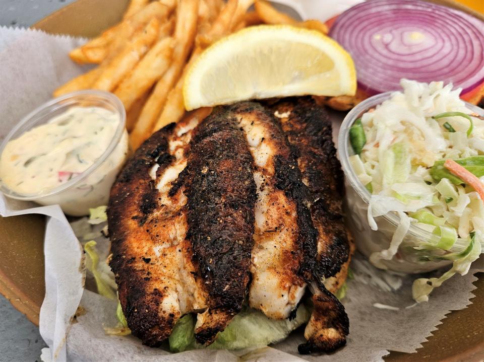 A blackened grouper sandwich at Tide Tables Restaurant and Marina photographed Feb. 13, 2024.