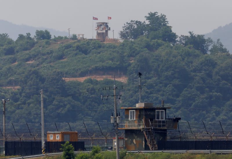 A North Korean soldier stands guard at his guard post inside North Korean territory, in this picture taken from Paju, South Korea, near the demilitarized zone (DMZ) separating the two Koreas