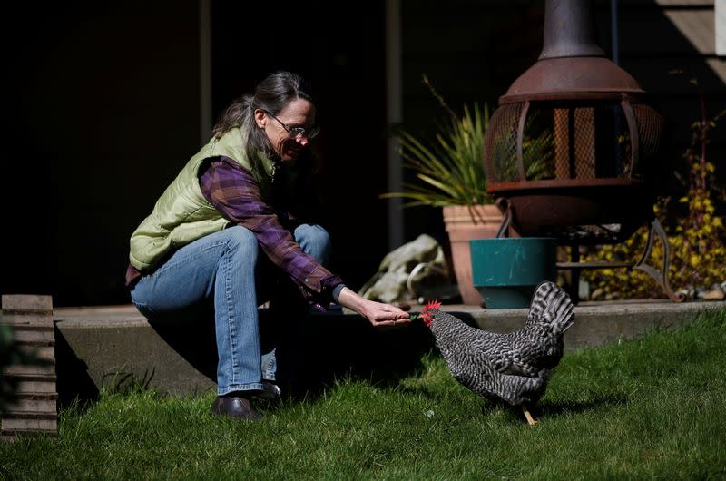 Cynthia Burrell, whose home-based business has been shuttered, at her home in Seattle