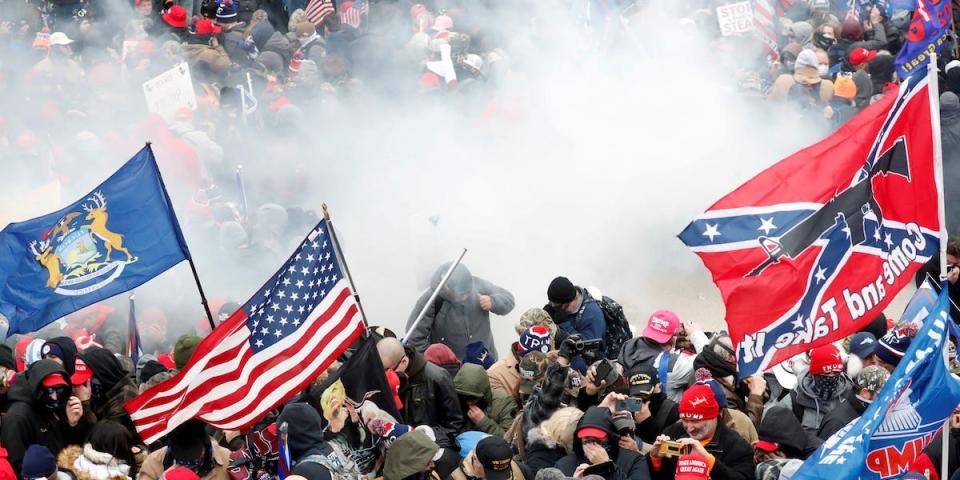 Tear gas is released into a crowd of protesters during clashes with Capitol police at a rally to contest the certification of the 2020 U.S. presidential election results by the U.S. Congress, at the U.S. Capitol Building in Washington, U.S, January 6, 2021. REUTERS/Shannon Stapleton/File Photo