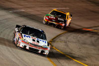 RICHMOND, VA - APRIL 28: Tony Stewart, driver of the #14 Mobil 1/Office Depot Chevrolet, leads Kyle Busch, driver of the #18 M&M's Ms. Brown Toyota, during the NASCAR Sprint Cup Series Capital City 400 at Richmond International Raceway on April 28, 2012 in Richmond, Virginia. (Photo by Tom Pennington/Getty Images for NASCAR)