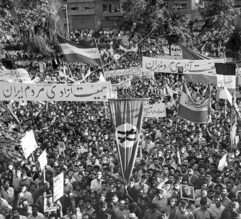 FILE - A selection of the huge crowd massed in parliament square after Prime Minister Mohammad Mossadegh announced he had smashed a pro-shah coup d'etat in Tehran, Iran on Aug. 16, 1953. In August 1953, a CIA-backed coup toppled Iran's prime minister, cementing the rule of Shah Mohammad Reza Pahlavi for over 25 years before the 1979 Islamic Revolution. (AP Photo, File)