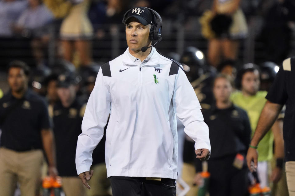 Wake Forest head coach Dave Clawson walks onto the field to argue a call during the first half of an NCAA college football game against Army in Winston-Salem, N.C., Saturday, Oct. 8, 2022. (AP Photo/Chuck Burton)