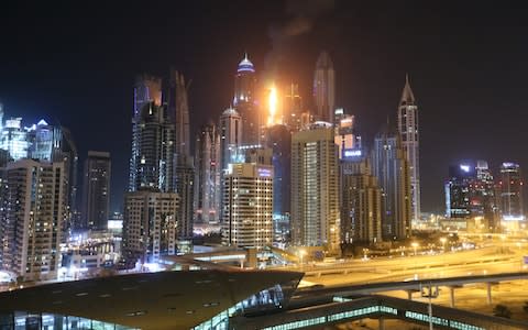 The fire can be seen in the Dubai skyline - Credit: Getty