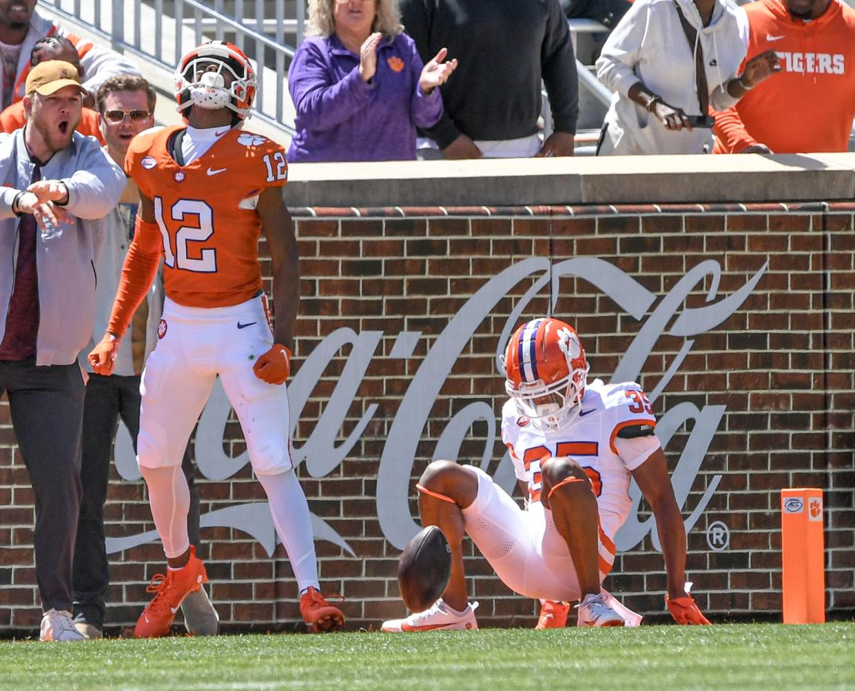 Clemson wide receiver Bryant Wesco Jr. (12) celebrates his touchdown catch near Clemson defensive back Austin Randall (35) during the first quarter of the Spring football game in Clemson, S.C. Saturday, April 6, 2024.