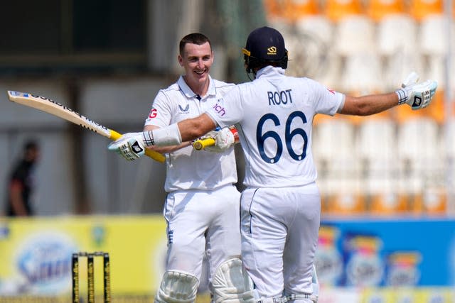 England’s Harry Brook celebrates with Joe Root