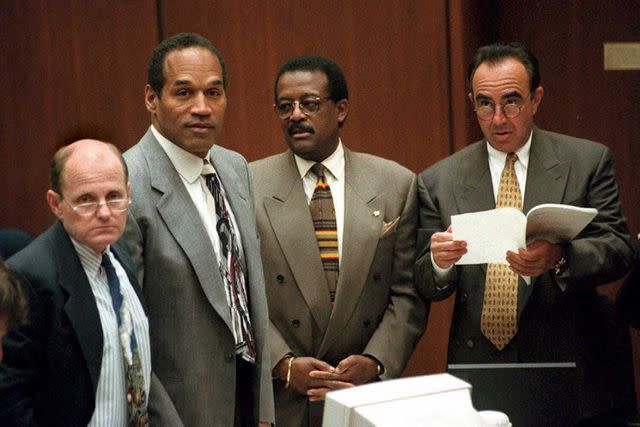 <p>VINCE BUCCI / POOL / AFP</p> Murder defendant OJ Simpson (2nd L) stands with his attorneys Robert Blasier (L), Johnnie Cochran Jr (2nd from R) and Robert Shapiro (R) on April 26.