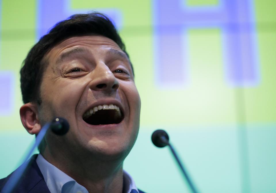 Ukrainian comedian and presidential candidate Volodymyr Zelenskiy speaks to the media and his supporters at his headquarters after the second round of presidential elections in Kiev, Ukraine, Sunday, April 21, 2019. A comedian whose only political experience consists of playing a president on TV appeared poised to reprise the role in real life when an exit poll showed him winning Ukraine's presidential runoff Sunday in a landslide. (AP Photo/Sergei Grits)