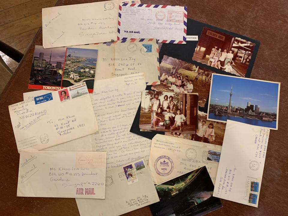 Some of the letters and postcards sent by the Vietnamese refugee children Alvina Khoo once watched over, from countries like the United States, New Zealand, Norway and Canada. PHOTO: Nicholas Yong/Yahoo News Singapore 