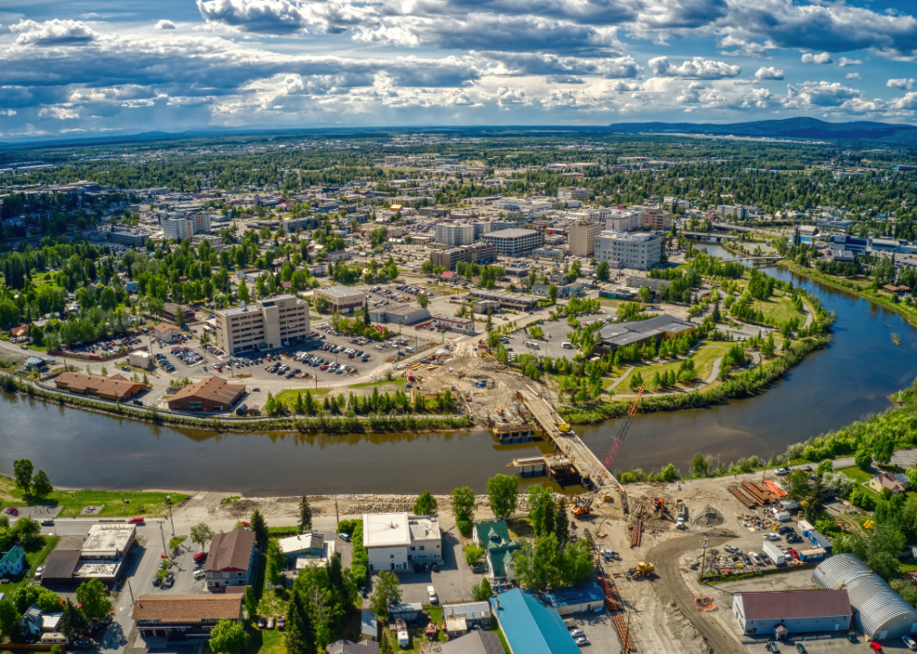 Aerial view of a city with the river around it. 