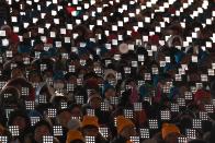 <p>People attend the opening ceremony of the Pyeongchang 2018 Winter Olympic Games at the Pyeongchang Stadium on February 9, 2018. / AFP PHOTO / Mark RALSTON </p>