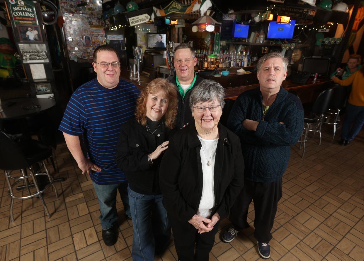 The McGinnity family in the landmark tavern, McGinnity's. In front is Bridie McGinnity with daughter Maggie McGinnity-Fitzgibbon and sons Kevin, Jimmy and John McGinnity.