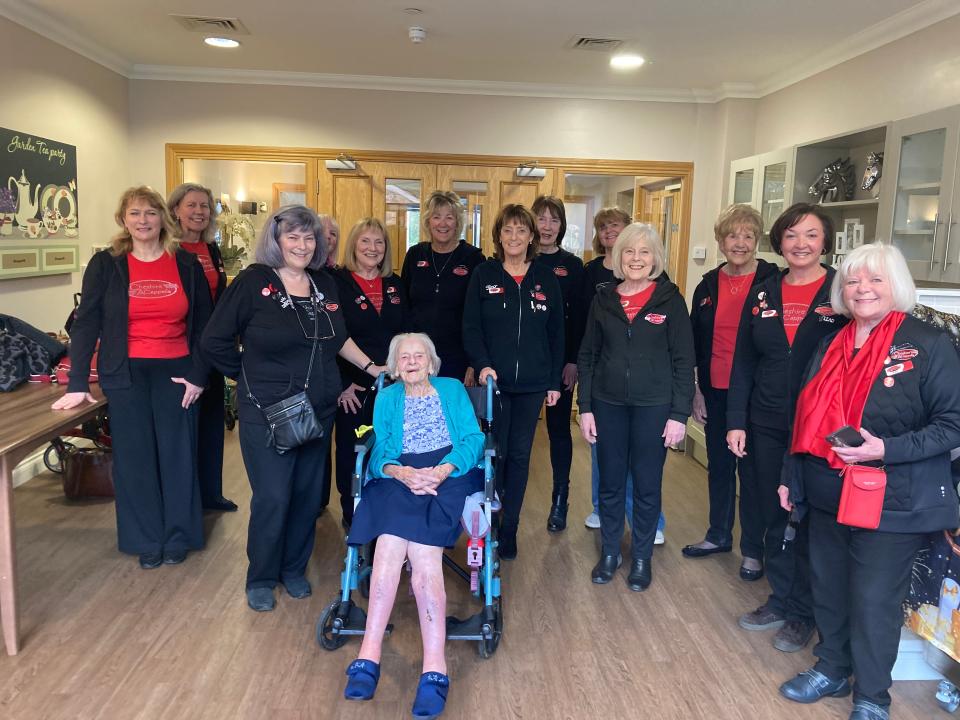 Joyce Preston with staff at Abney Court care home on her 100th birthday.