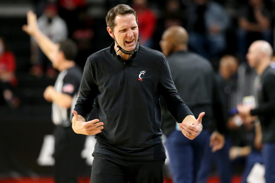 Cincinnati Bearcats head coach John Brannen expresses frustration toward the bench in the second half of a men's NCAA basketball game against the Memphis Tigers, Sunday, Feb. 28, 2021, at Fifth Third Arena in Cincinnati. The Memphis Tigers won, 80-74.