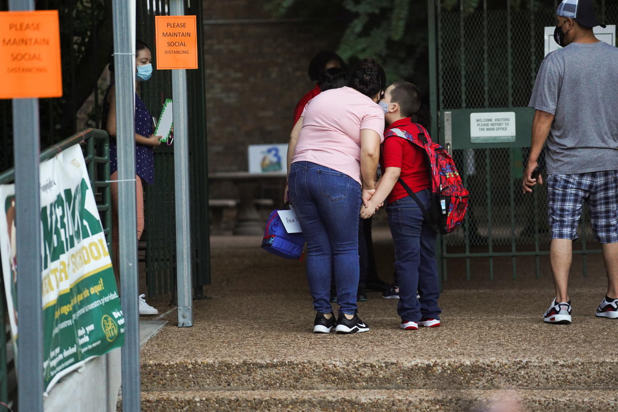 A student before entering Benbrook Elementary School in Houston on the first day of school on Aug. 23. (Reuters/Go Nakamura)