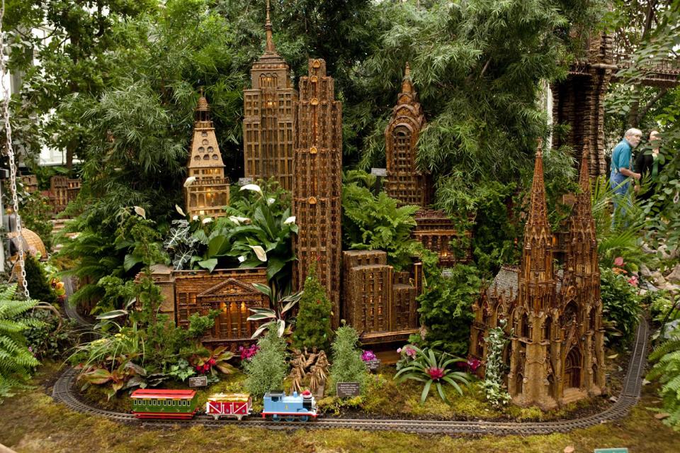 This November 2012 photo provided by the New York Botanical Garden shows the annual holiday train show at the garden in the Bronx borough of New York, where model trains on view in the Enid A. Haupt Conservancy wind past 140 buildings depicting New York City, including landmarks like the original Yankee Stadium, St. Patrick's Cathedral and the Brooklyn Bridge. Holiday train shows also take place at a number of other botanic gardens around the country including those in Chicago and Cincinnati. (AP Photo/New York Botanical Garden, Ivo M. Vermeulen)