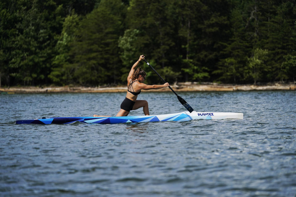 Canoe sprint world champion Nevin Harrison, 19, of Seattle, trains near Lake Lanier Olympic Park on Thursday, July 1, 2021, in Gainesville, Ga. Harrison won the world championship in the women's sprint canoe 200 meters as a 17-year-old in 2019. Now she'll try to duplicate that at the Olympics in Tokyo where the race will be a new event in a bid for gender equity. (AP Photo/Brynn Anderson)