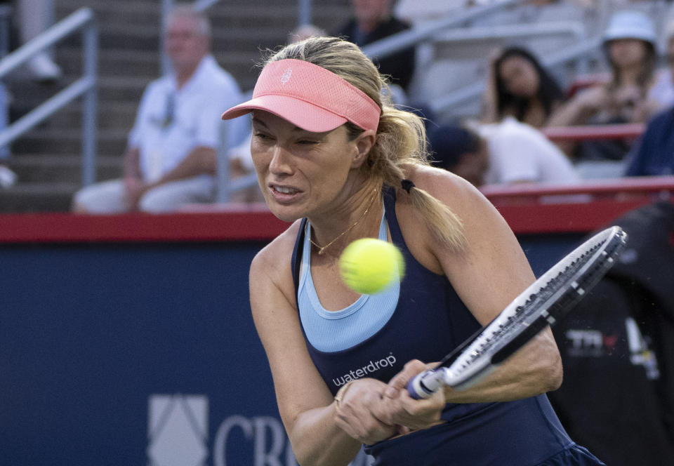 Danielle Collins, of the United States, hits a return to Iga Swiatek, of Poland, during the National Bank Open women’s tennis tournament Friday, Aug. 11, 2023, in Montreal. (Christinne Muschi/The Canadian Press via AP)