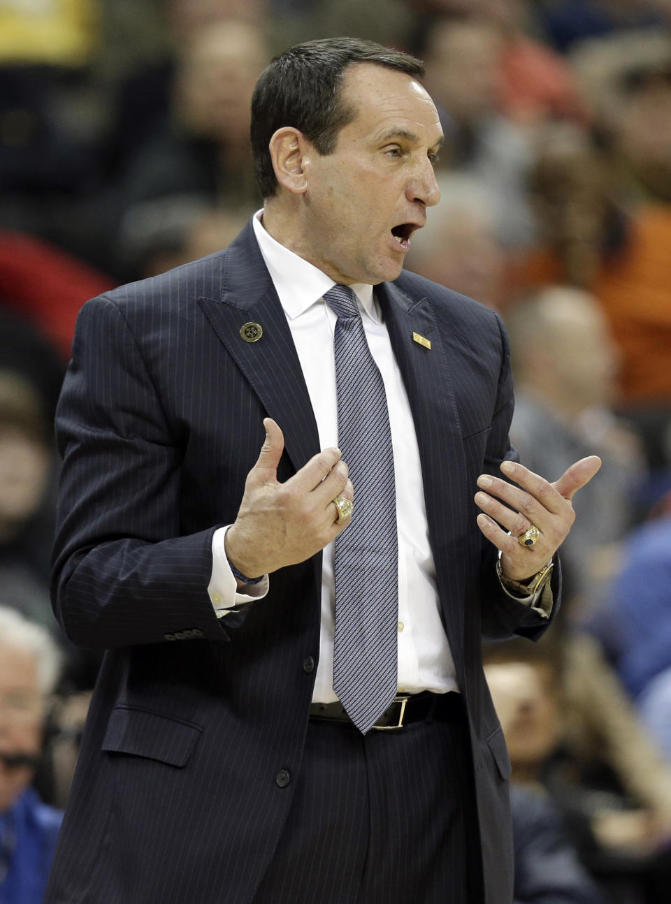 In this photo taken Wednesday, March 5, 2014, Duke head coach Mike Krzyzewski argues a call during the first half of an NCAA college basketball game against Wake Forest in Winston-Salem, N.C. Coach Krzyzewski is out of the hospital after feeling light-headed after a loss at Wake Forest. The school said in a statement Thursday, March 6, that Krzyzewski was taken to Duke University Hospital in Durham for a precautionary examination after the 82-72 loss in Winston-Salem.(AP Photo/Chuck Burton)