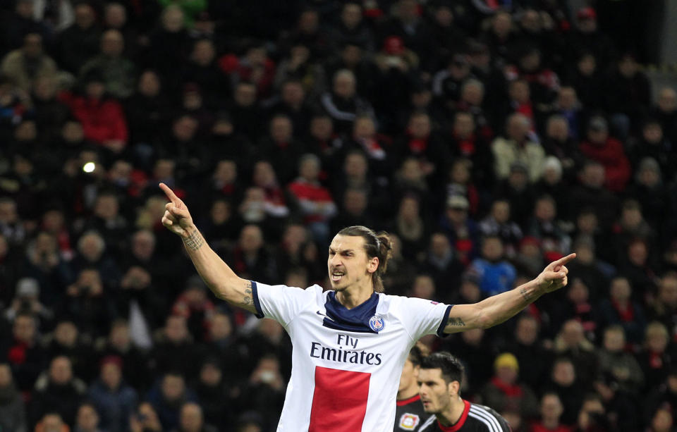 PSG's Zlatan Ibrahimovic celebrates after scoring during a Champions League round of the last 16 first leg soccer match between Bayer Leverkusen and Paris Saint-Germain in Leverkusen, Germany, Tuesday Feb. 18, 2014. (AP Photo/Frank Augstein)