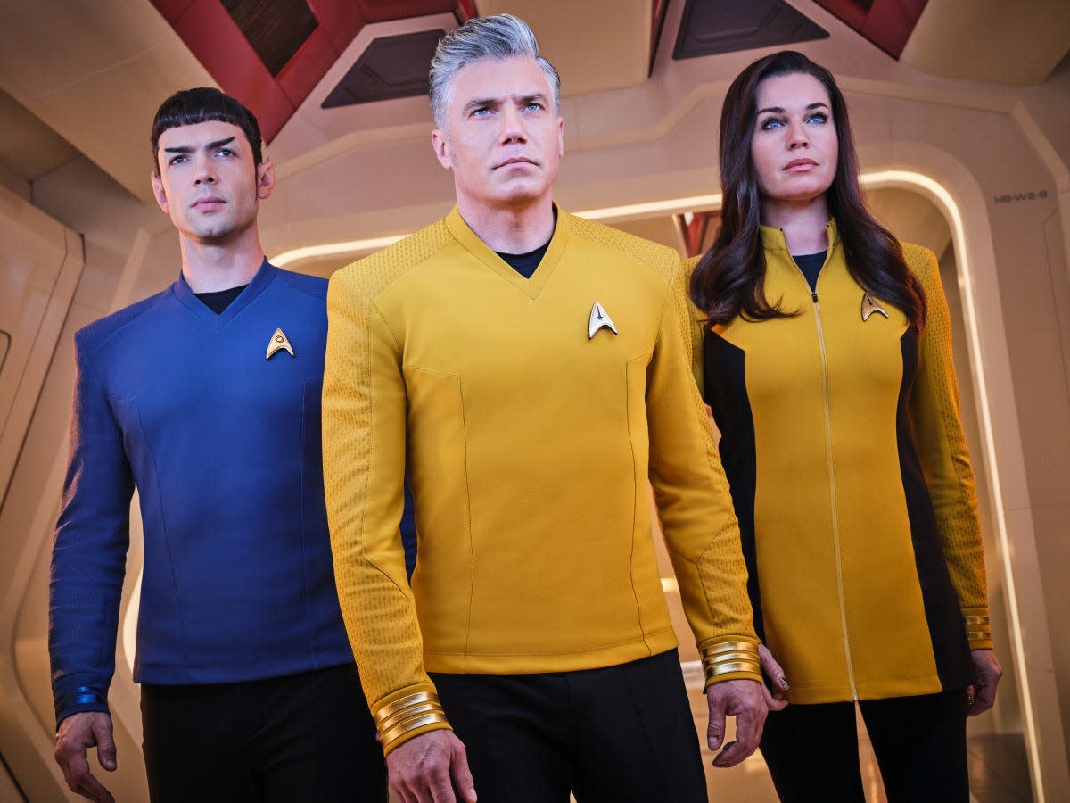 From left, Ethan Peck as Spock, Anson Mount as Pike and Rebecca Romijn as Una of the Paramount+ original series “Star Trek: Strange New Worlds.”