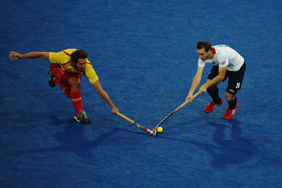 LONDON, ENGLAND - AUGUST 07: Nicholas Caitlin of Great Britain and Ramon Allegre of Spain challenge for the ball during the Men's Hockey match between Great Britain and Spain on Day 11 of the London 2012 Olympic Games at Riverbank Arena Hockey Centre on August 7, 2012 in London, England. (Photo by Daniel Berehulak/Getty Images)