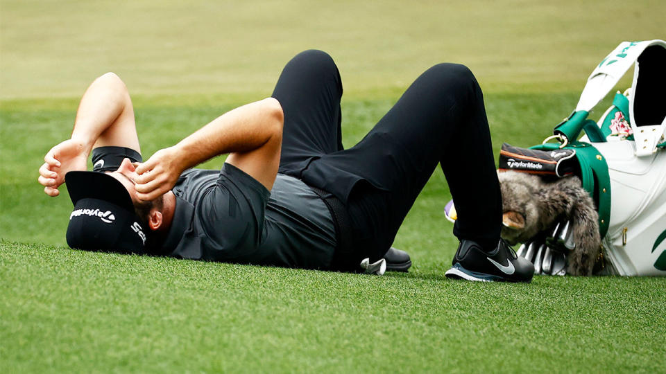 Matt Wolff (pictured) lying on the ground after enduring a tough Day 2 at the Masters.