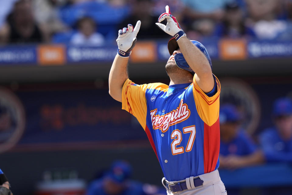 Venezuela's Jose Altuve (27) crosses the plate to score on a solo home run during the second inning of an exhibition baseball game against the New York Mets, Thursday, March 9, 2023, in Port St. Lucie, Fla. (AP Photo/Lynne Sladky)