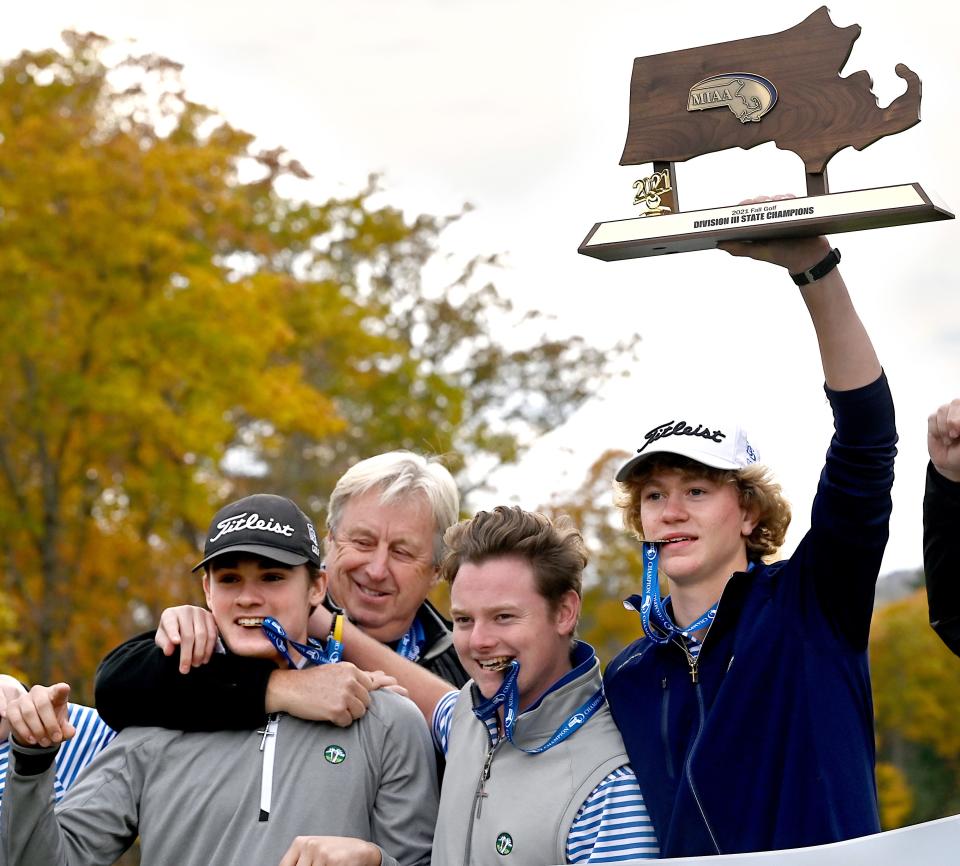 Owen Bingham (second from right) celebrates the Dover-Sherborn Regional High School golf team’s state championship win with his teammates and coach at Shining Rock Golf Club in Northbridge, Massachusetts, on Nov. 2, 2021.
