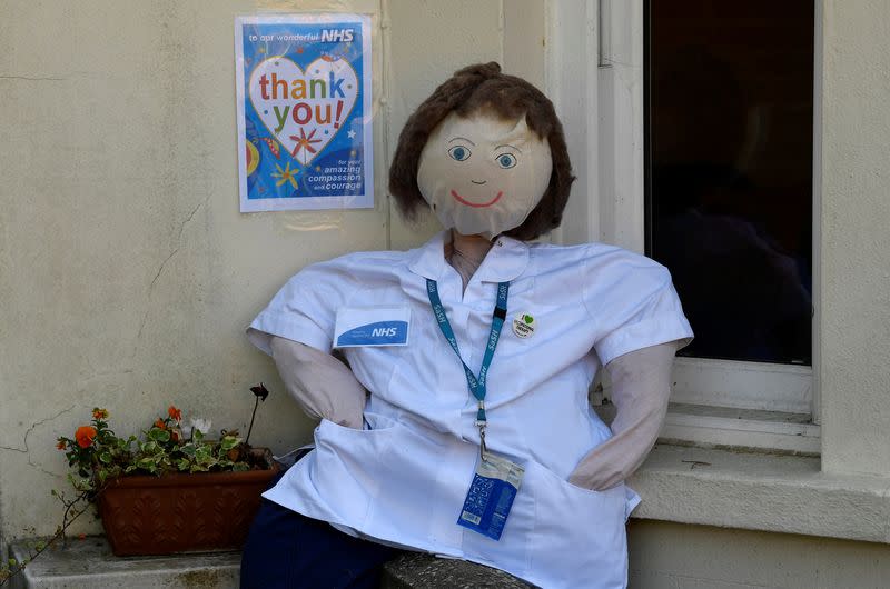 Scarecrows representing key workers lighten the daily lockdown walk, as the number of the coronavirus disease cases (COVID-19) grows around the world, in the village of Capel