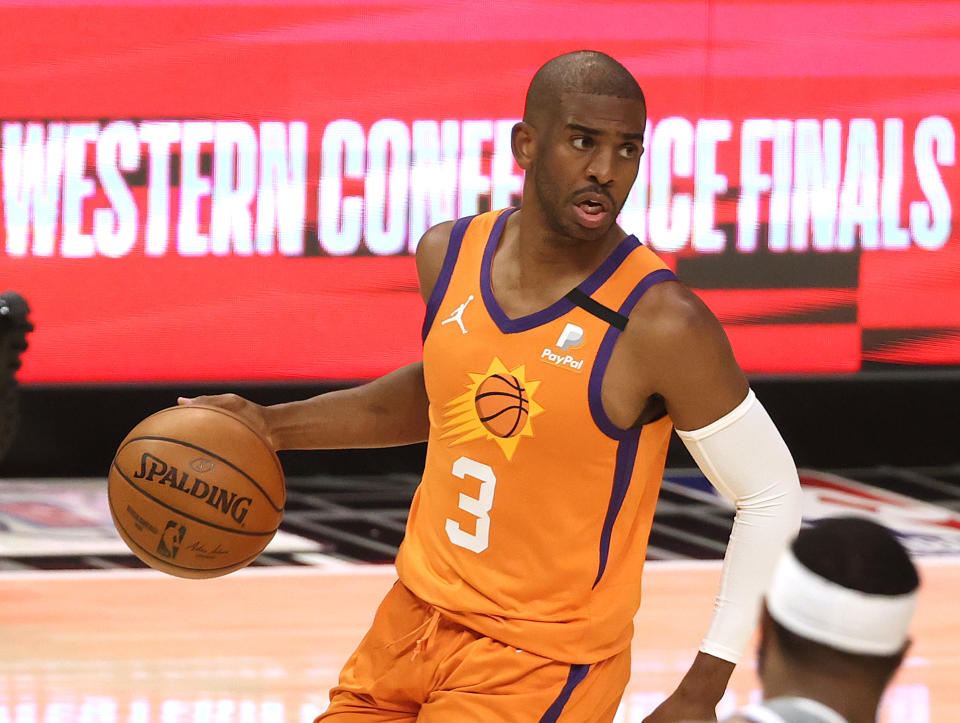 LOS ANGELES, CALIFORNIA - JUNE 26: Chris Paul #3 of the Phoenix Suns brings the ball up court against the LA Clippers in game four of the Western Conference Finals at Staples Center on June 26, 2021 in Los Angeles, California. NOTE TO USER: User expressly acknowledges and agrees that, by downloading and or using this photograph, User is consenting to the terms and conditions of the Getty Images License  (Photo by Ronald Martinez/Getty Images)