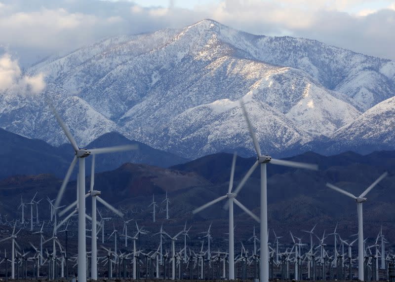 FILE PHOTO: Snow is seen on the San Gorgonio Mountains behind a windmill farm in Palm Springs