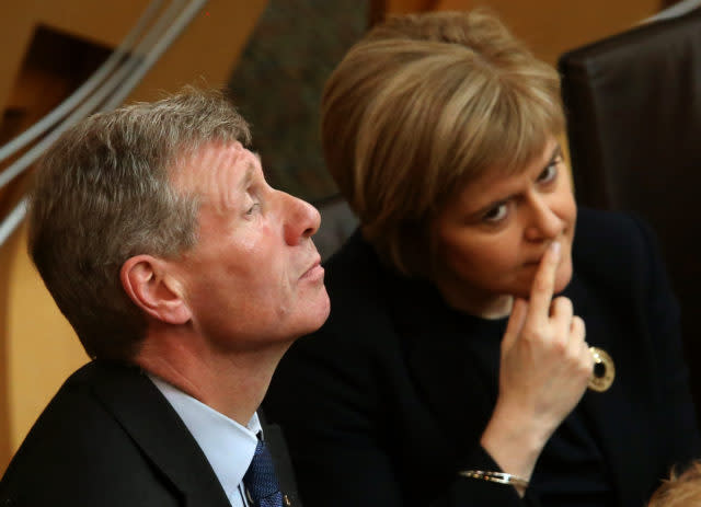 Former justice secretary Kenny MacAskill with First Minister Nicola Sturgeon (Andrew Milligan/PA)