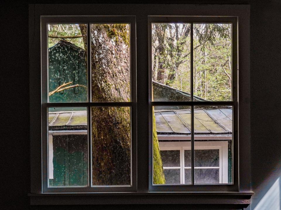 A cabin is seen from a window