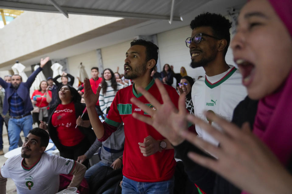 Moroccans celebrate in Rabat, Morocco, Saturday Dec. 10, 2022, after their team's victory against Portugal in the World Cup quarterfinal soccer match played in Qatar. (AP Photo/Mosa'ab Elshamy)