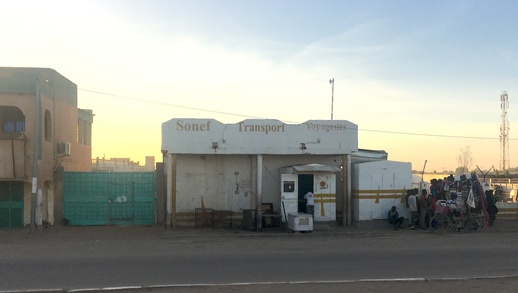 Empty store front on quiet road.