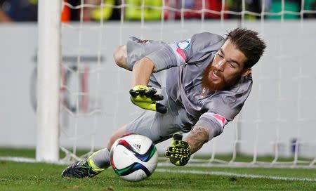 Portugal's Jose Sa saves a penalty during the shootout.Action Images via Reuters / Carl Recine