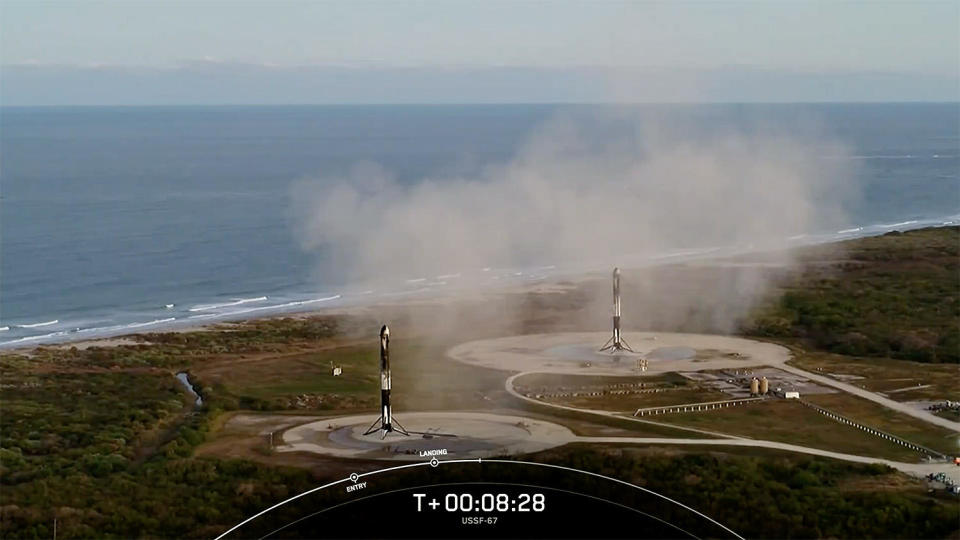 The Falcon Heavy's two side boosters completed side-by-side landings at the Cape Canaveral Space Force Station after helping boost the rocket out of the lower atmosphere. / Credit: SpaceX