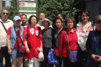 Wang Qiaoling (4th L), the wife of rights lawyer Li Heping, and supporters gather near a petition office for the Supreme People's Court in Beijing, China May 12, 2017. REUTERS/Christian Shephard