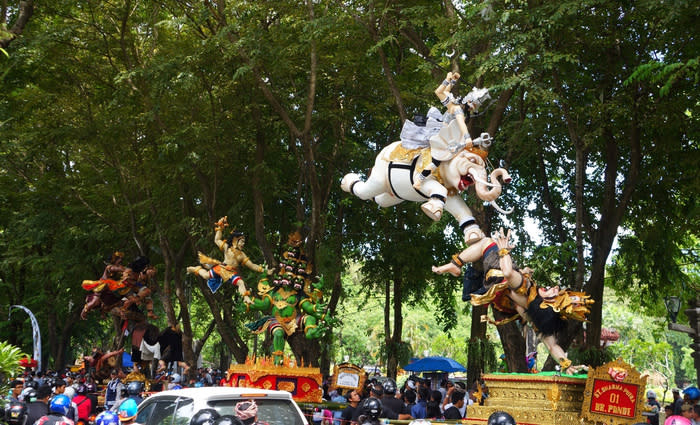 Parade: Heavy traffics are commonly found as the drivers slow down to see the Ogoh-ogoh parked beside the road. (