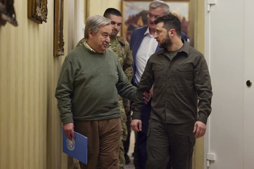 FILE - In this image provided by the Ukrainian Presidential Press Office, Ukrainian President Volodymyr Zelenskyy, right, and U.N. Secretary-General Antonio Guterres leave a news conference during their meeting in Kyiv, Ukraine, Thursday, April 28, 2022. Ukrainian President Volodymyr Zelenskyy on Thursday, Aug. 18, 2022 is set to host his Turkish counterpart and the U.N. chief for talks about the implementation of a deal to resume Ukraine grain exports, the volatile situation at a Russia-occupied nuclear power plant and diplomatic efforts to help end the war. (Ukrainian Presidential Press Office via AP, File)