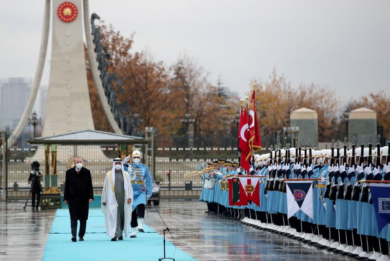 Turkish President Tayyip Erdogan and Abu Dhabi Crown Prince Sheikh Mohammed bin Zayed al-Nahyan review a guard of honour, in Ankara