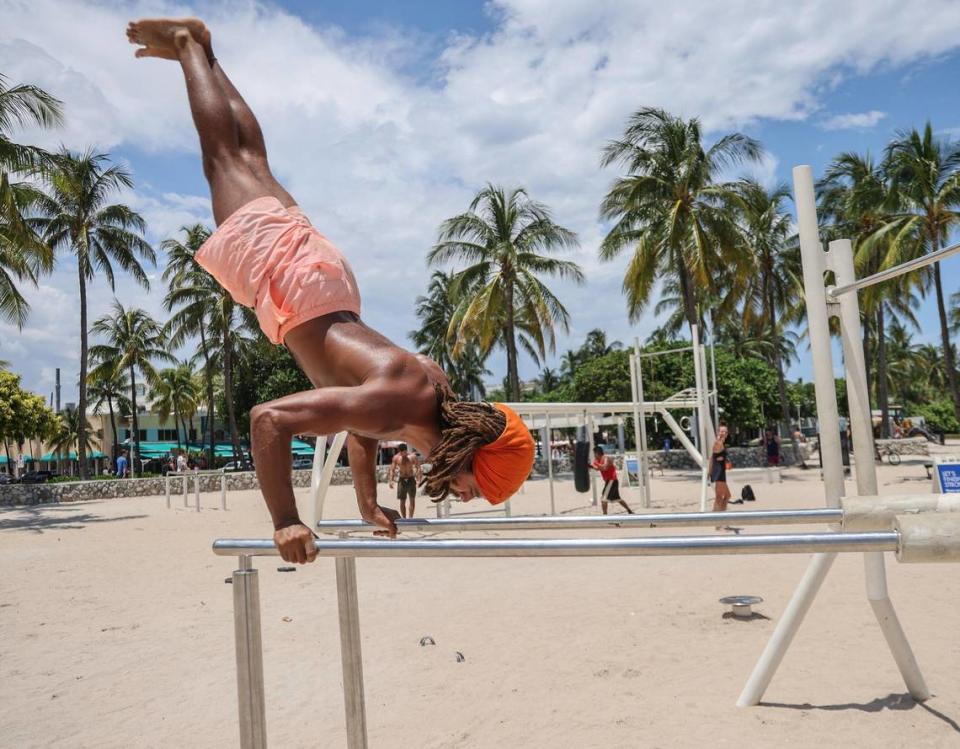 Massage therapist and yoga instructor Anthony Hazin, 31, exercises at the My Equilibra, a wellness park underneath the high noon sun as the temperature reached above 90 degrees on Miami Beach, Florida