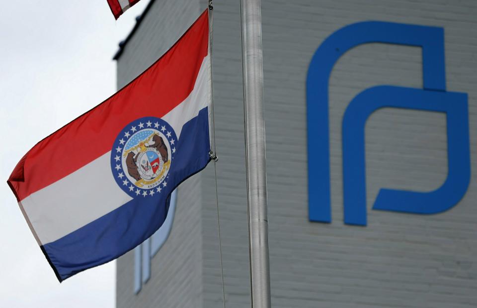 The Missouri state flag flies outside of the Planned Parenthood of the St. Louis Region and Southwest Missouri, the state's last operating abortion clinic, Friday, June 21, 2019. in St. Louis. Missouri's health department said on Friday that it won’t renew the abortion license for the state’s lone clinic, but the St. Louis Planned Parenthood affiliate will be allowed to temporarily perform the procedure under a court order. (Christian Gooden/St. Louis Post-Dispatch via AP)