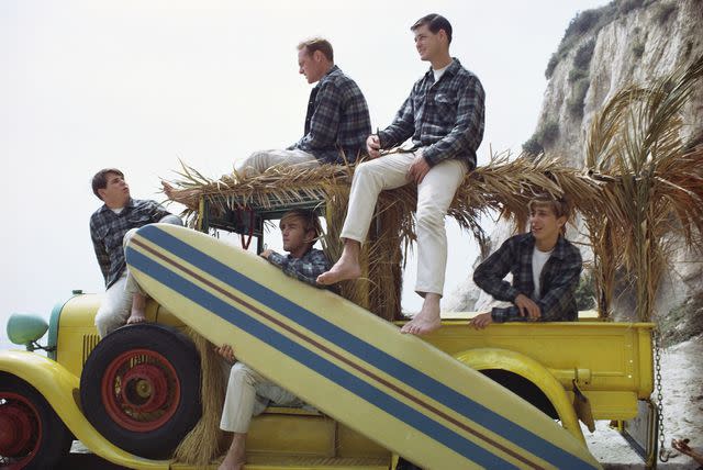 <p>Michael Ochs Archives/Getty</p> Carl Wilson, Mike Love, Dennis Wilson, Brian Wilson, and David Marks in August 1962 in Los Angeles, California.