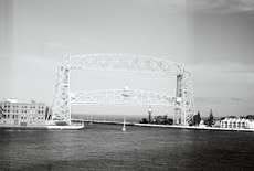 The Duluth Aerial Lift Bridge raises to let a sailboat through. Photo by Jackie Finch