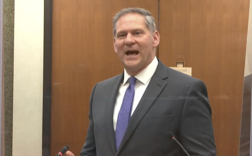 In this image from video, prosecutor Steve Schleicher questions witness Minneapolis Police sergeant John Edwards as Hennepin County Judge Peter Cahill presides Friday, April 2, 2021, in the trial of former Minneapolis police Officer Derek Chauvin at the Hennepin County Courthouse in Minneapolis, Minn. Chauvin is charged in the May 25, 2020 death of George Floyd. (Court TV via AP, Pool)