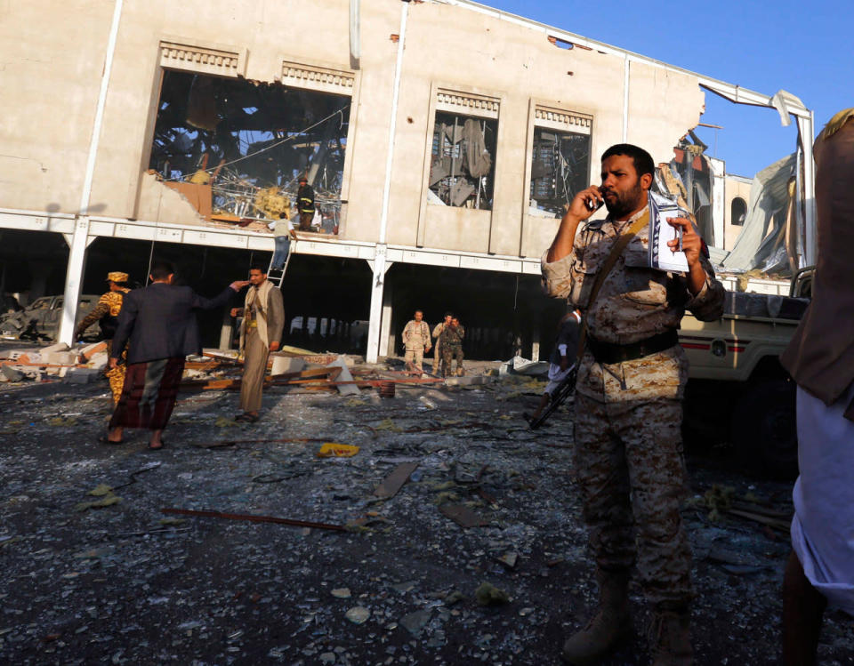 <p>People inspect the aftermath of a Saudi-led coalition airstrike in Sanaa, Yemen, Saturday, Oct. 8, 2016. (AP Photo/Osamah Abdulrhman)</p>