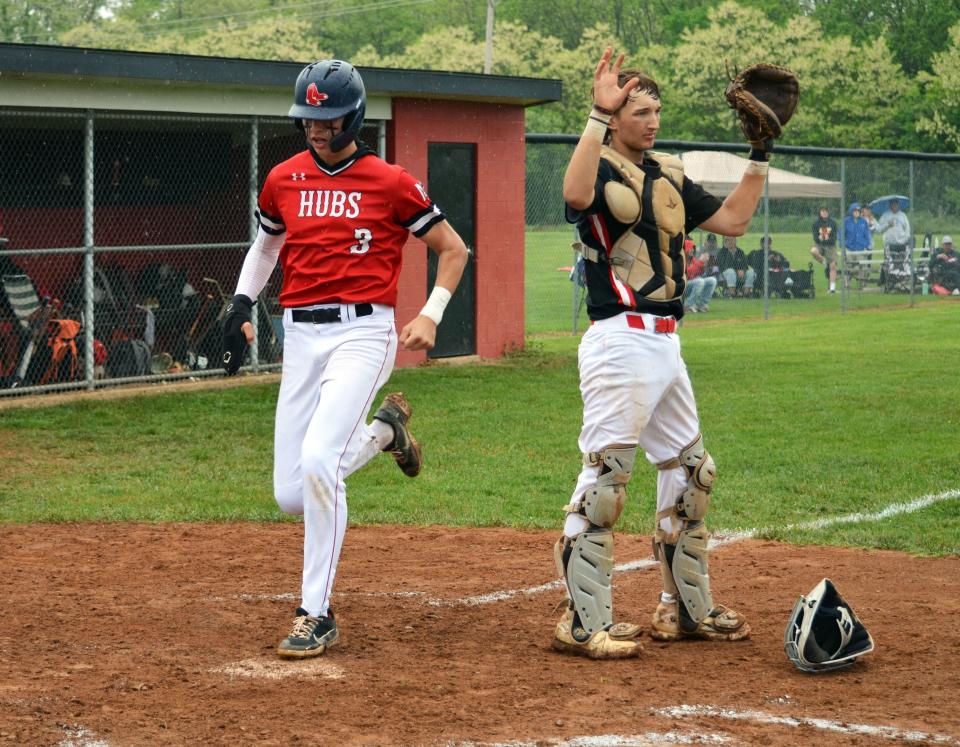 Mac Stiffler scores North Hagerstown's fifth run of the game during the Hubs' 9-3 playoff win over Linganore.